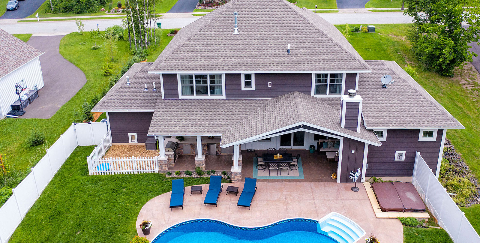 two-storey home with pool in backyard